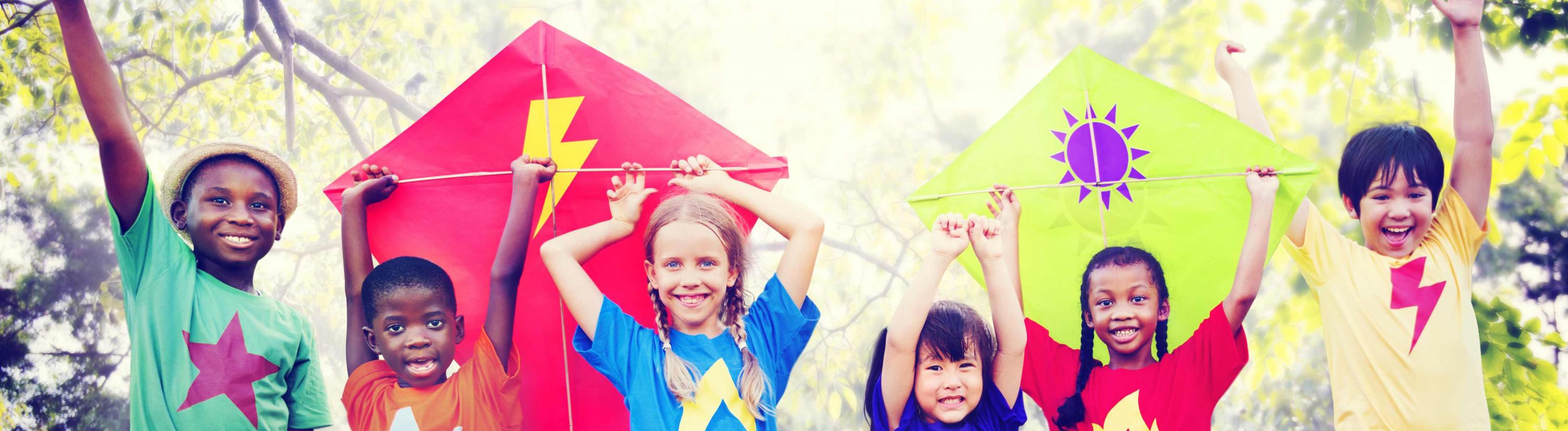 Banner image of children holding their hands up